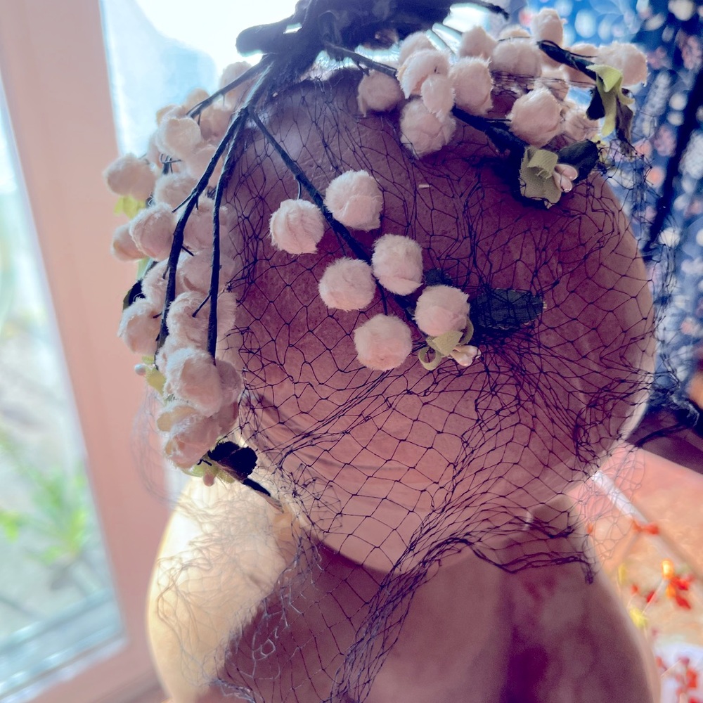 Vintage woman’s Floral netted hat goes back to the 50s